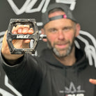 DMR Rider Ben Deakin holding a pedal