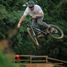 DMR Staff Member James Wyatt jumping a bike
