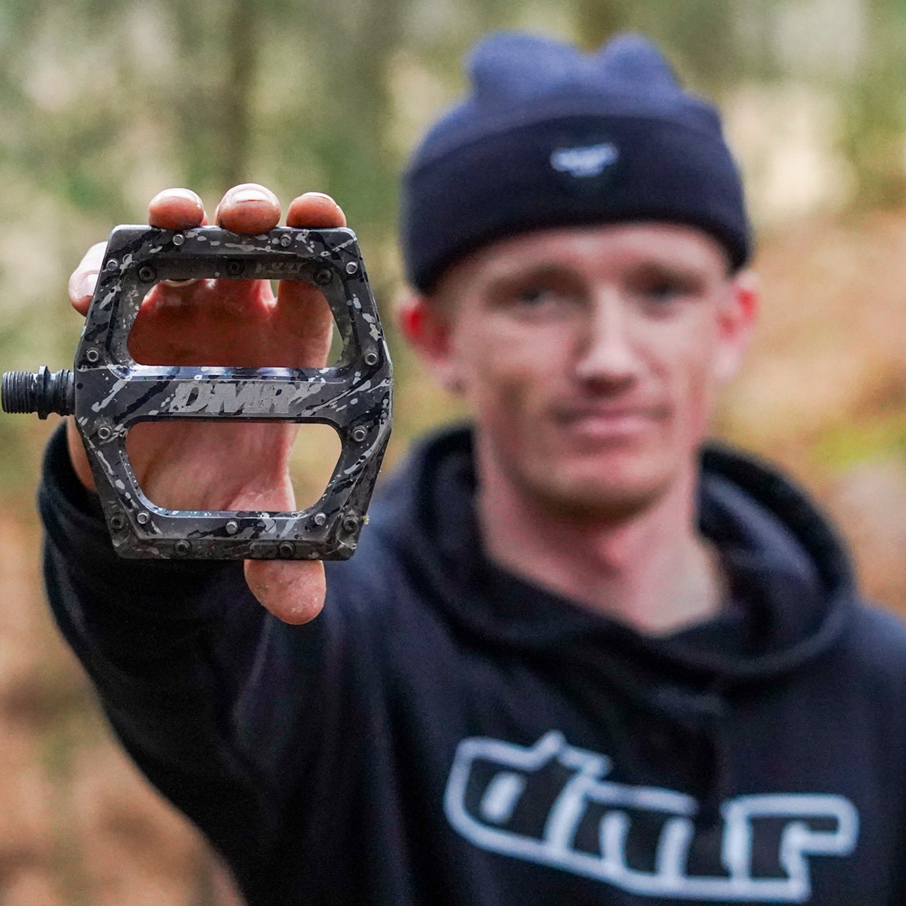 DMR Rider Sam Marzetti Holding a Pedal