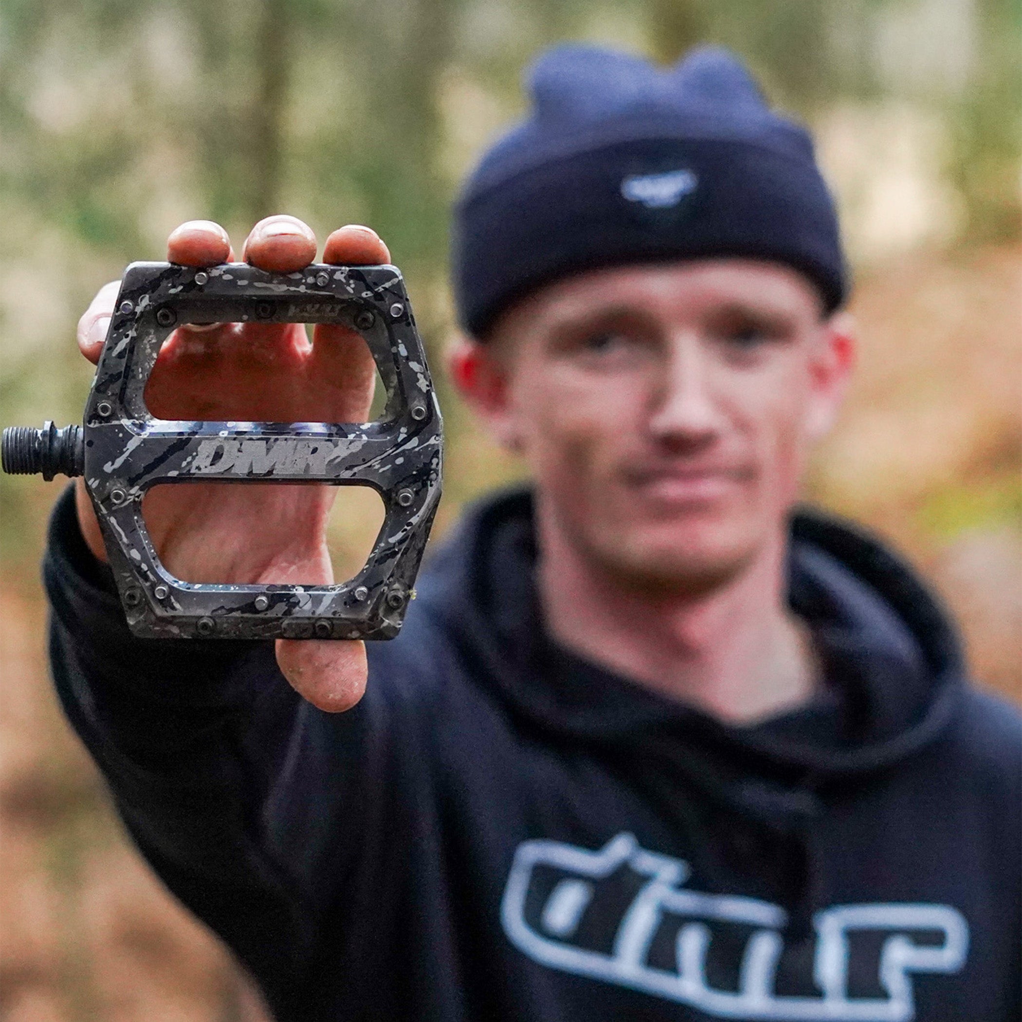 DMR Rider Sam Marzetti holding a pedal