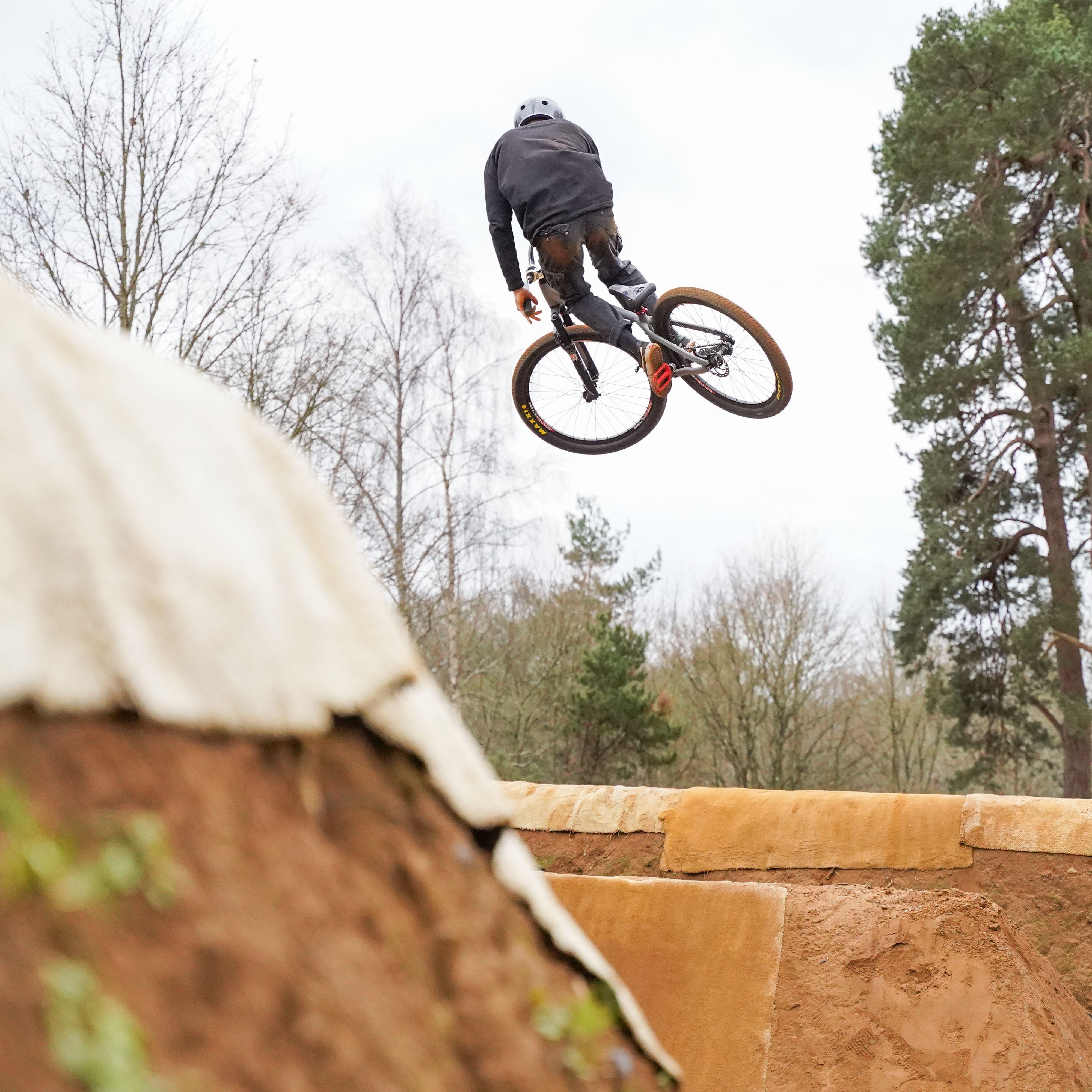 DMR Rider Jumping a Bike