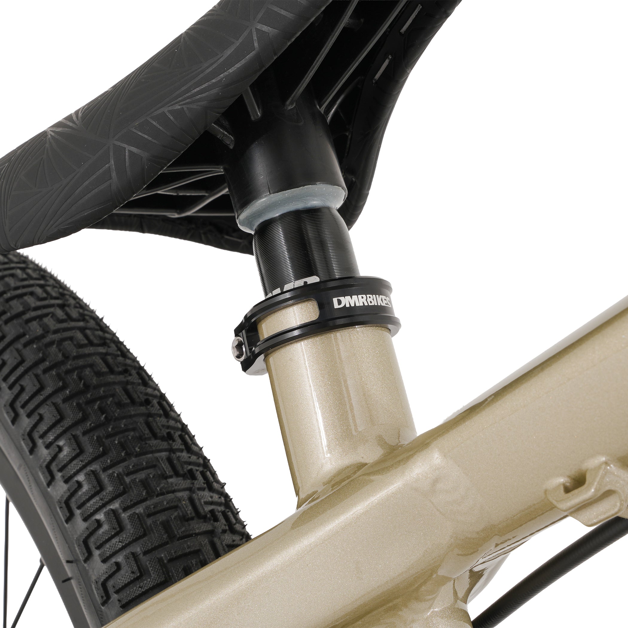 Close-up of a bicycle suspension fork with DMR branding on a white background