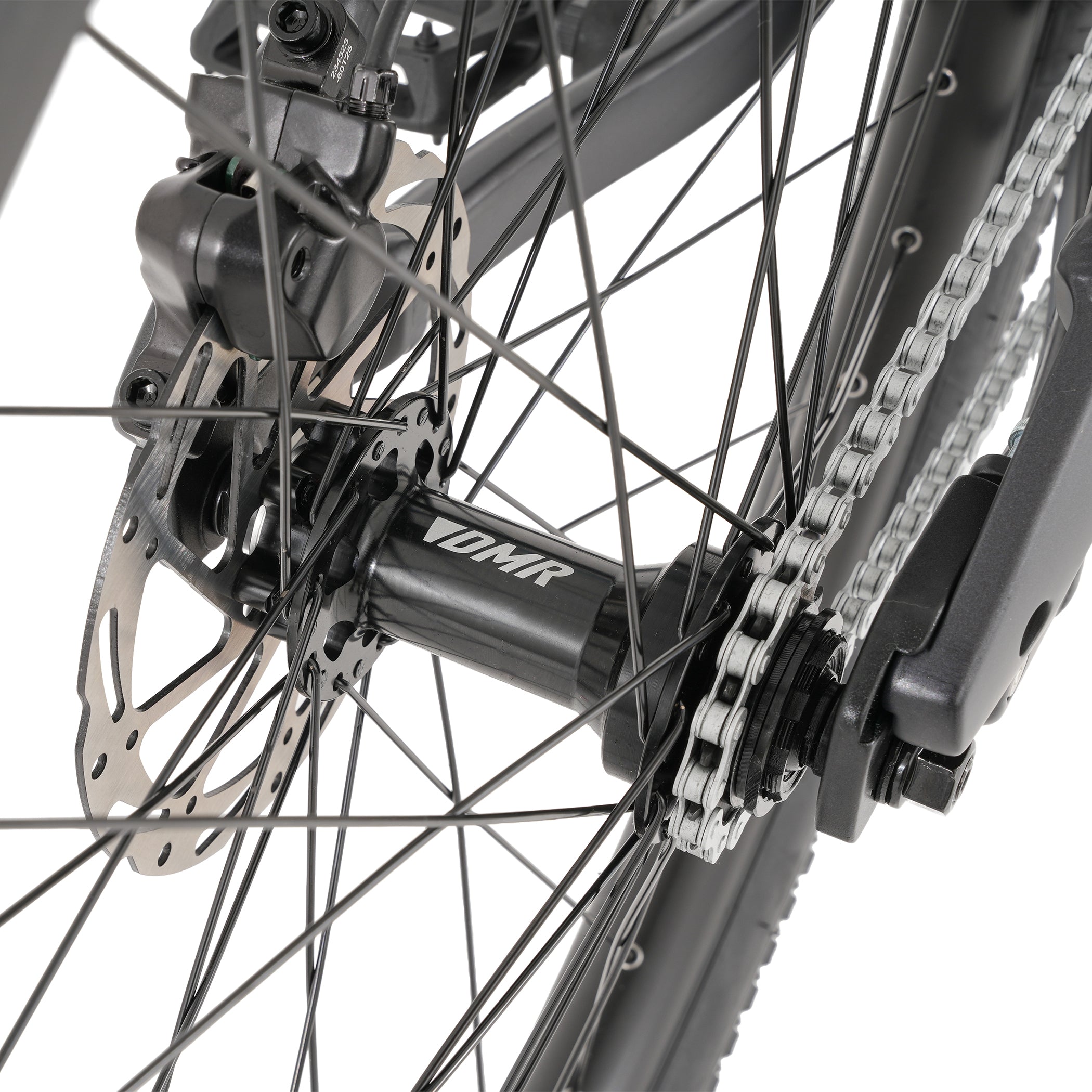Close-up of a bicycle wheel with chain and gear system on a white background