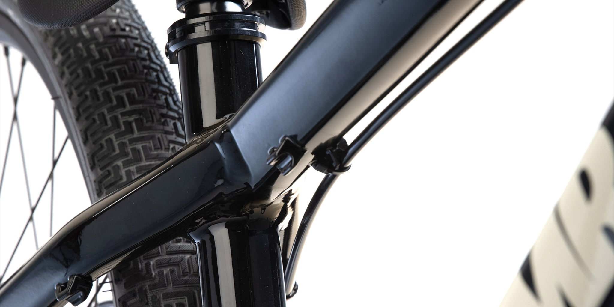 close-up of a dmr bikes rhythm pro dirt jumper bike frame in black, on a white background