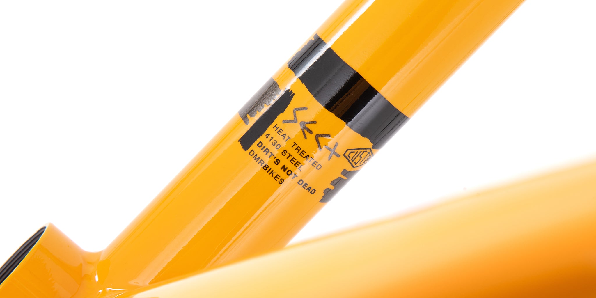 close-up of a dmr bikes sect custom dirt jumper bike frame in dakar yellow, on a white background