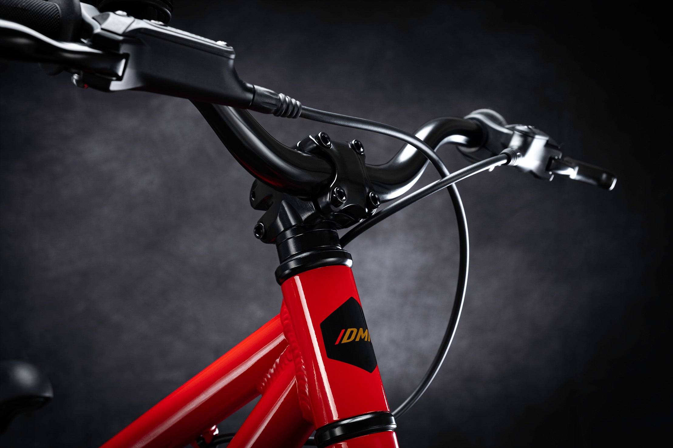 Close-up of a DMR Sidekick Pedal Children's Child's Kids off-road mountain cycle cycling bicycle bike. Primarily featuring the stem.