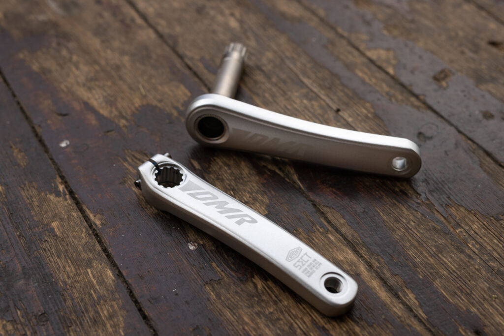 Bicycle cranks on a wooden surface