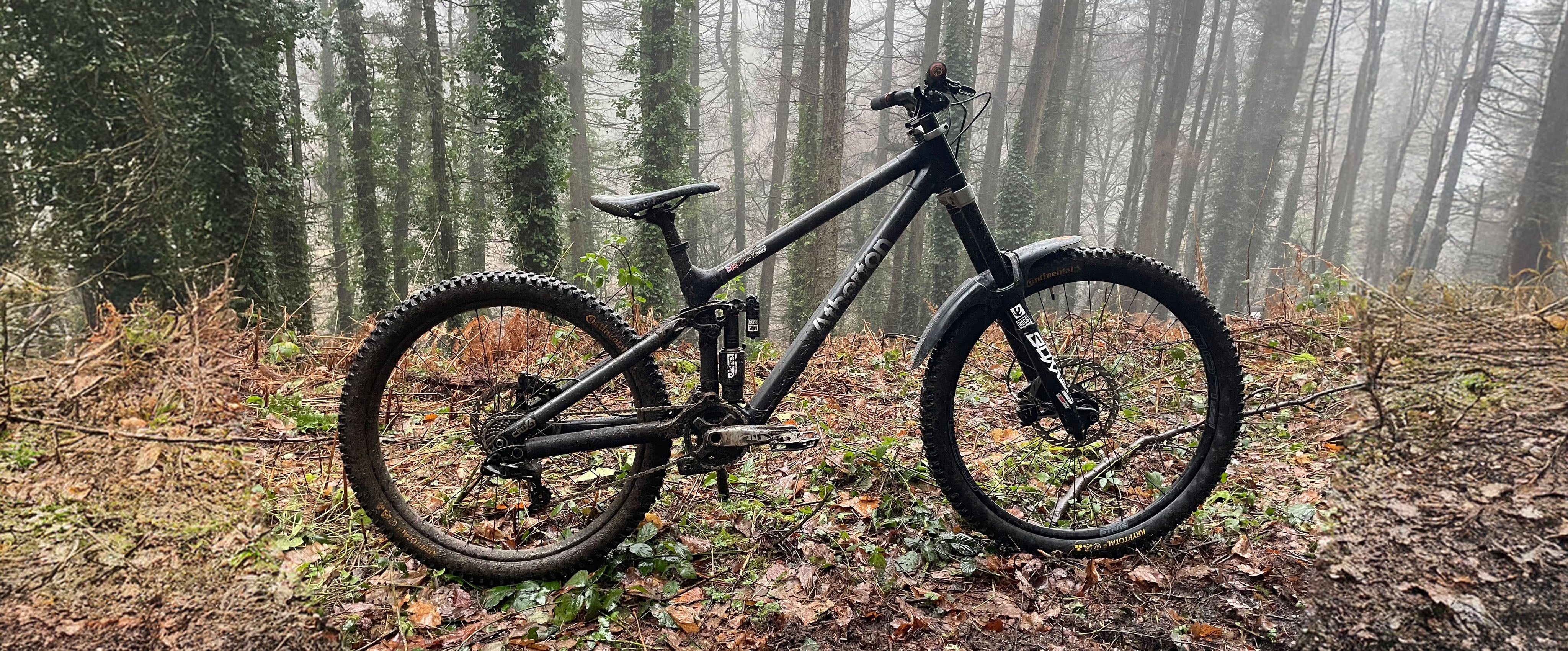 black bike have words on but not ride in the boom can i have lunch yes no but bicycle is good and background has