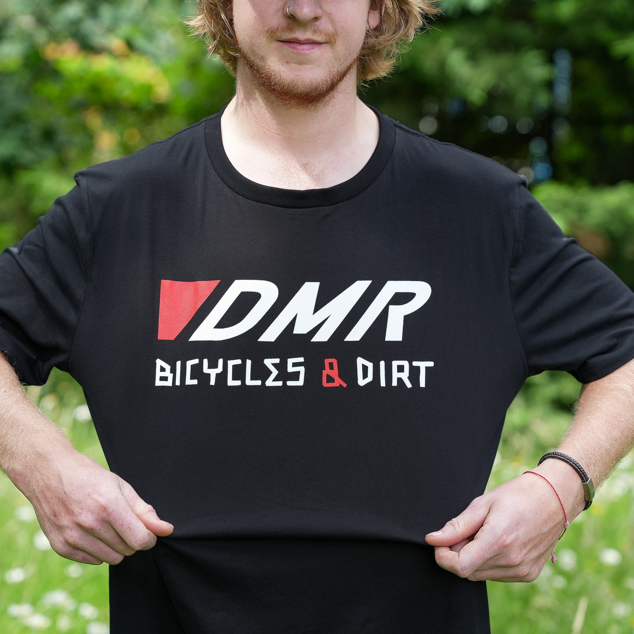 Team rider Andy Lehmann wearing a black t-shirt with DMR Bicycles & Dirt logo