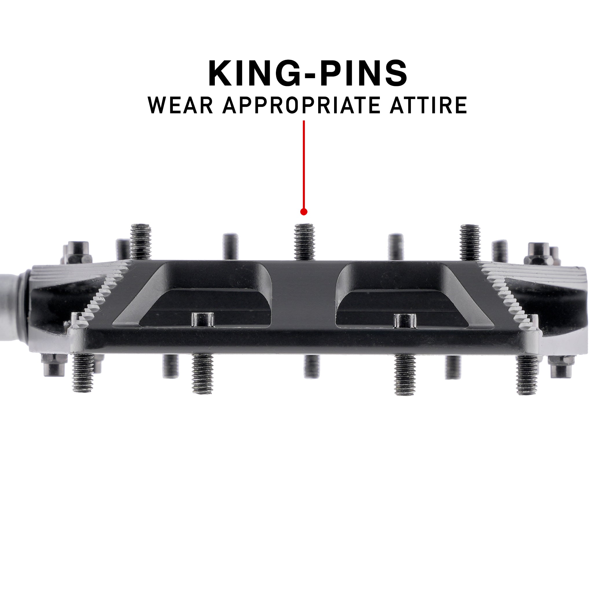 A black metal MTB pedal with threaded studs and a central plate, shown on a white background with text reading 'KING-PINS WEAR APPROPRIATE ATTIRE' and a red arrow pointing to one stud.