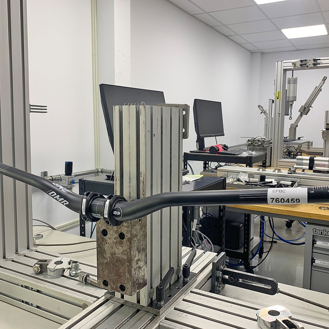 DMR Odub handlebar on a testing machine in a laboratory setting