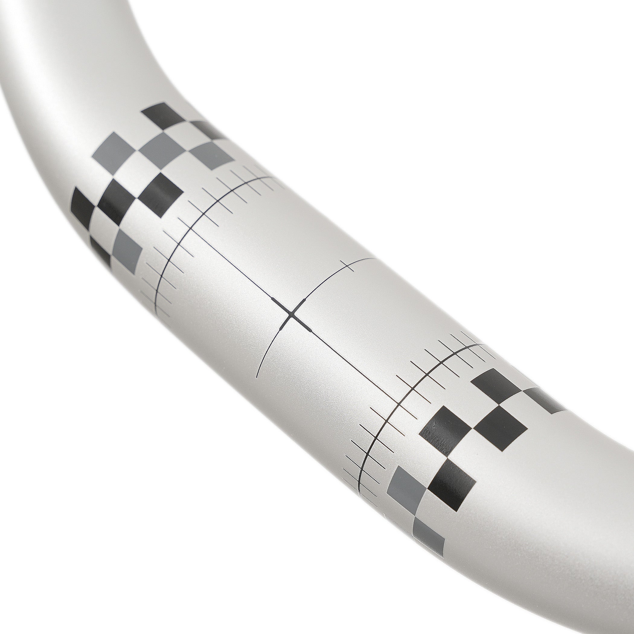 Close-up of a silver ODUB handlebar with black and gray chequered pattern and measurement lines.
