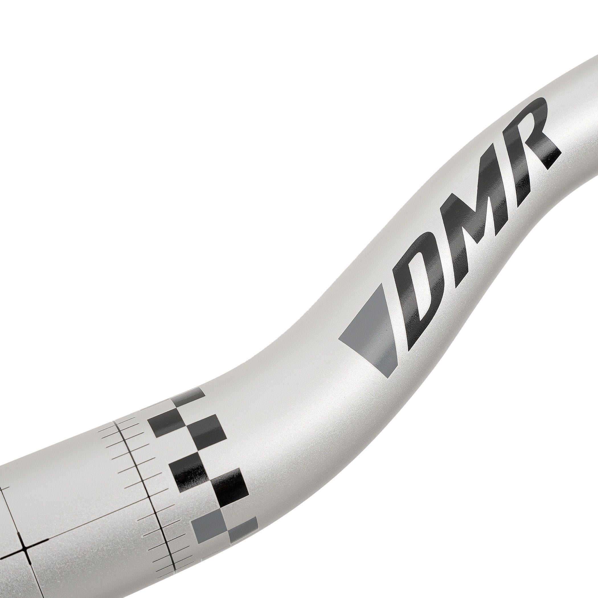 Close-up of a silver ODUB handlebar with the brand name 'DMR' printed in black and gray.