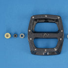 dmr bikes bicycles v12 v 12 twelve mtb bike cycling pedal body with bearing, nut and end cap on a blue background