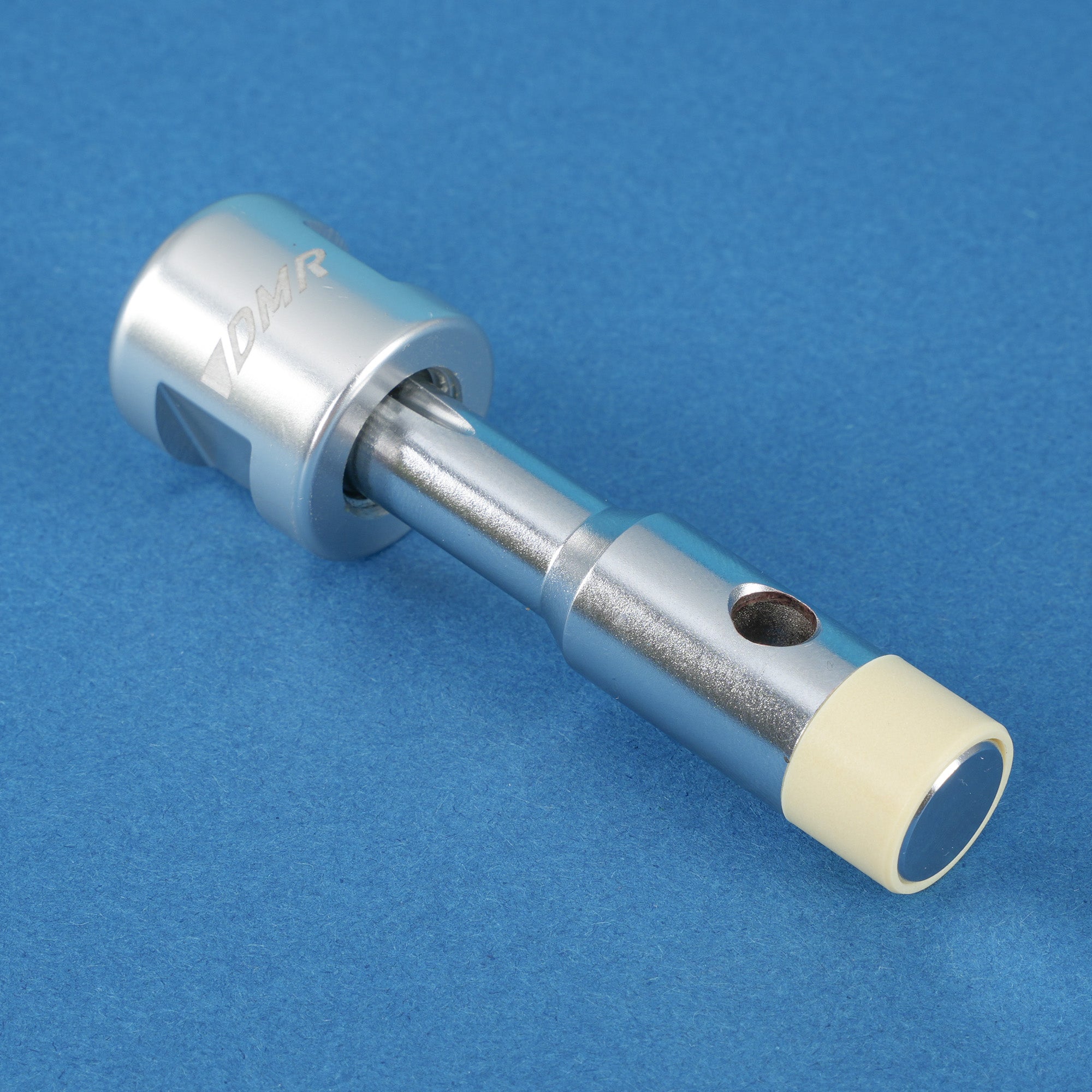 DMR pedal service tool on a blue background