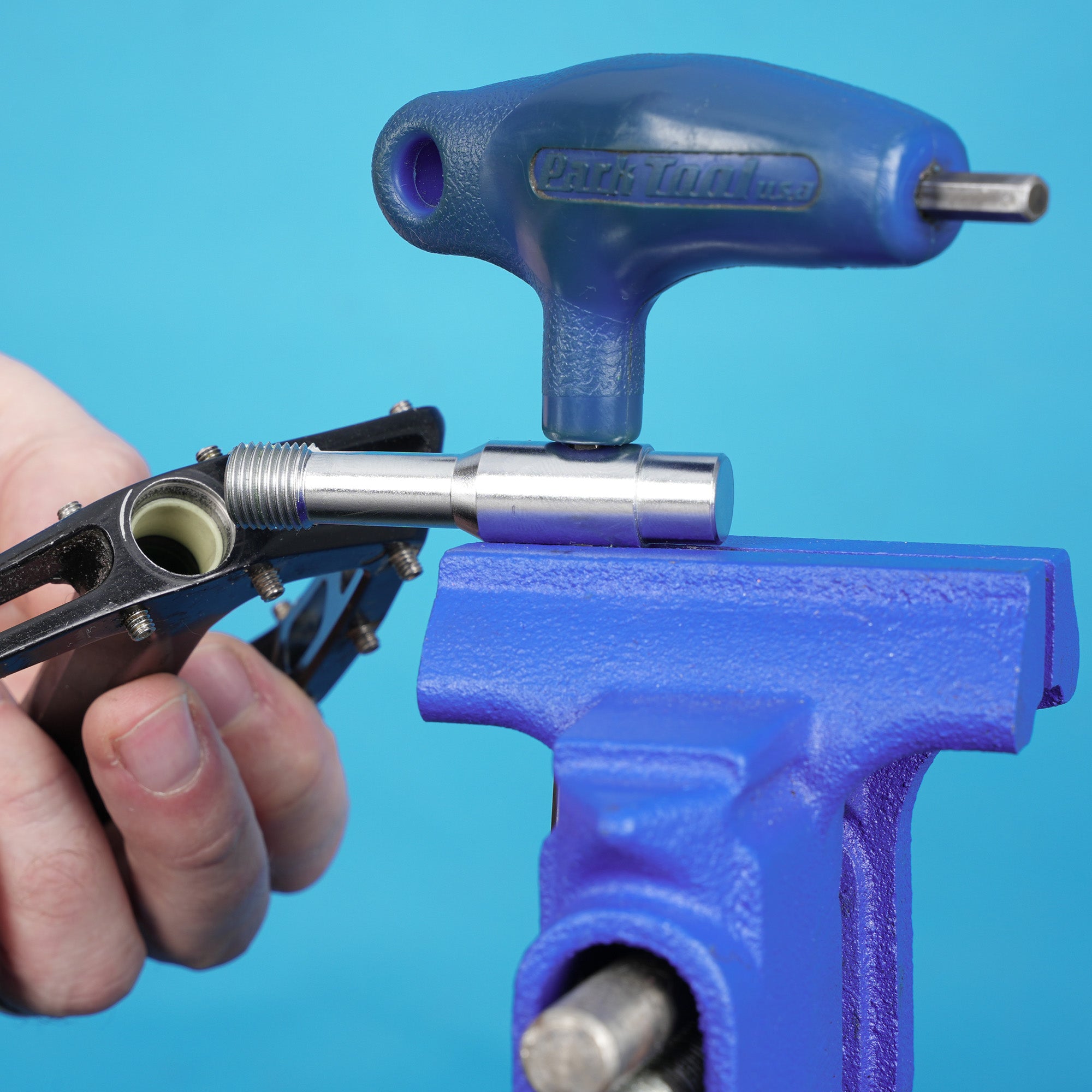 silver dmr bikes bicycles vmax vault mag magnesium midi v12 v11 flat4 flat 4 four versa clip clipless pedals pedal service servicing tool with allen key and pedal body on a blue background