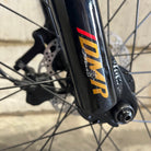 Close-up of a Ex Display DMR Sidekick Ride Bike fork with 'scratches