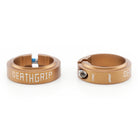 Two gold locking collar grip clamps with DMR Deathgrip 2 branding on a white background