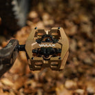 Close-up of the Light Bronze DMR VMAX clipless clip-in clip clipped SPD off-road mountain cycling bicycle bike pedalling pedal product, with an autumnal background composing of leaves other foliage.