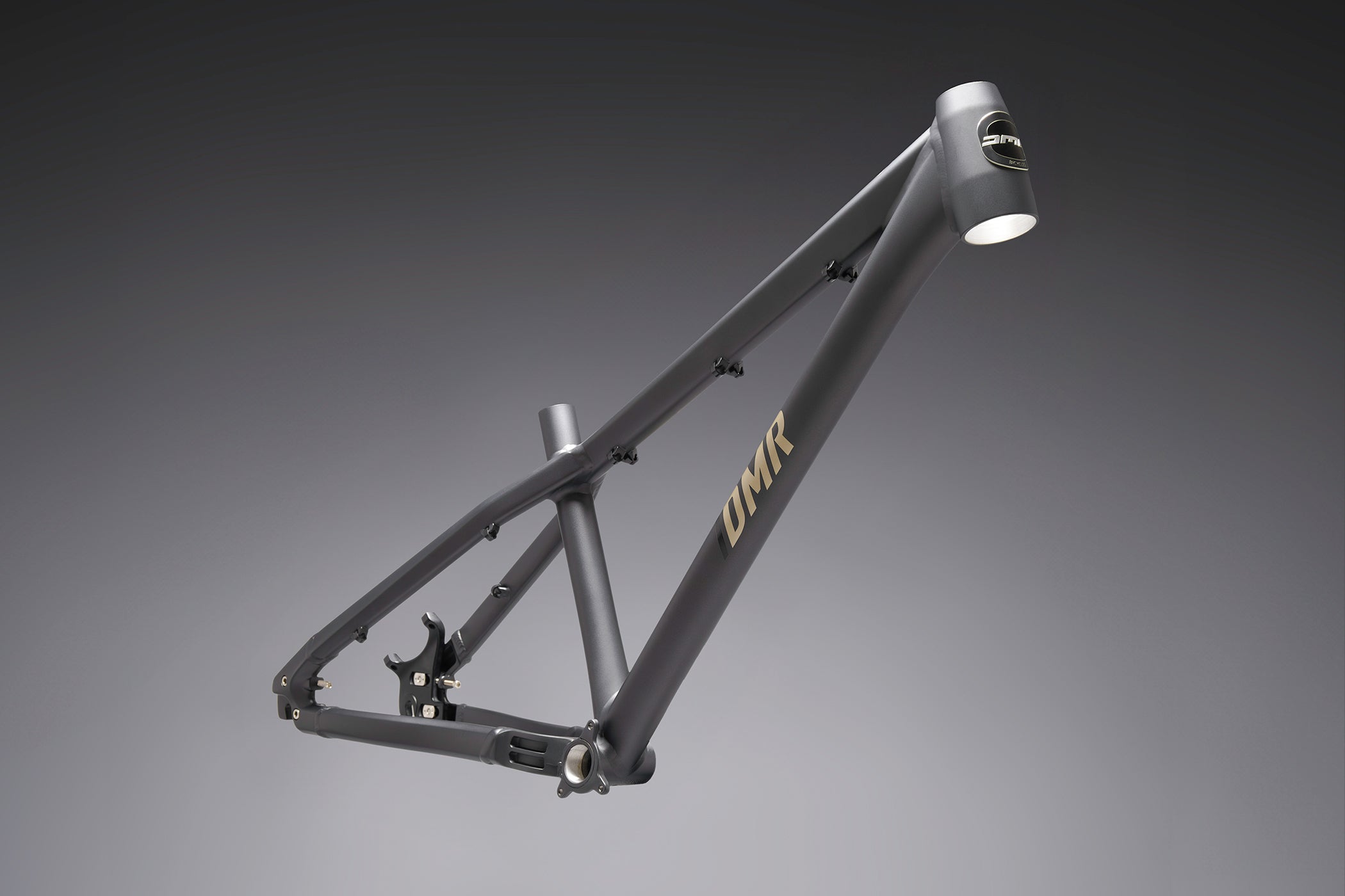 Dirt jump mtb bicycle frame with 'DMR' branding on a grey background